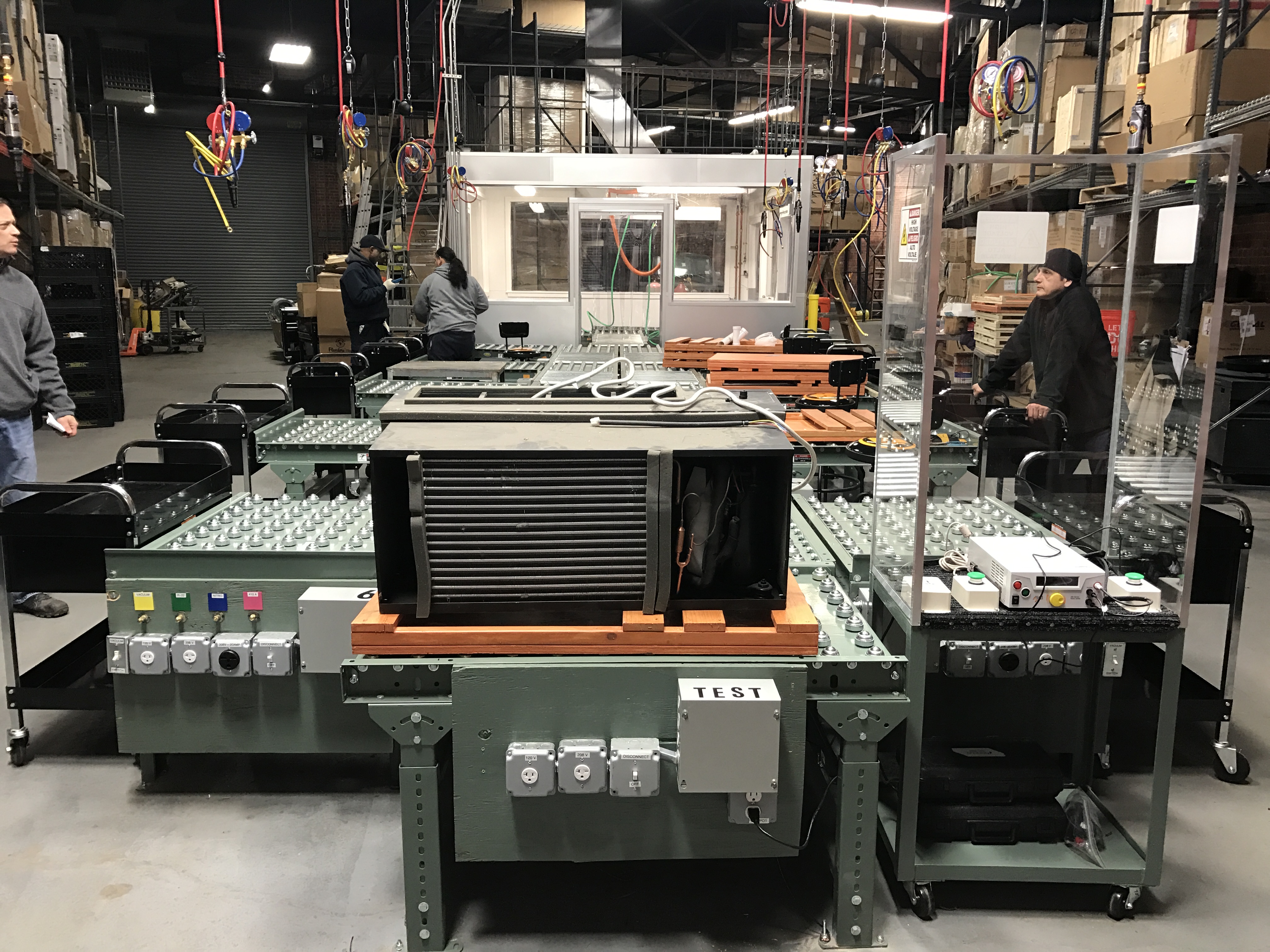 Figlia and Sons in-house PTAC repair assembly line with test stations