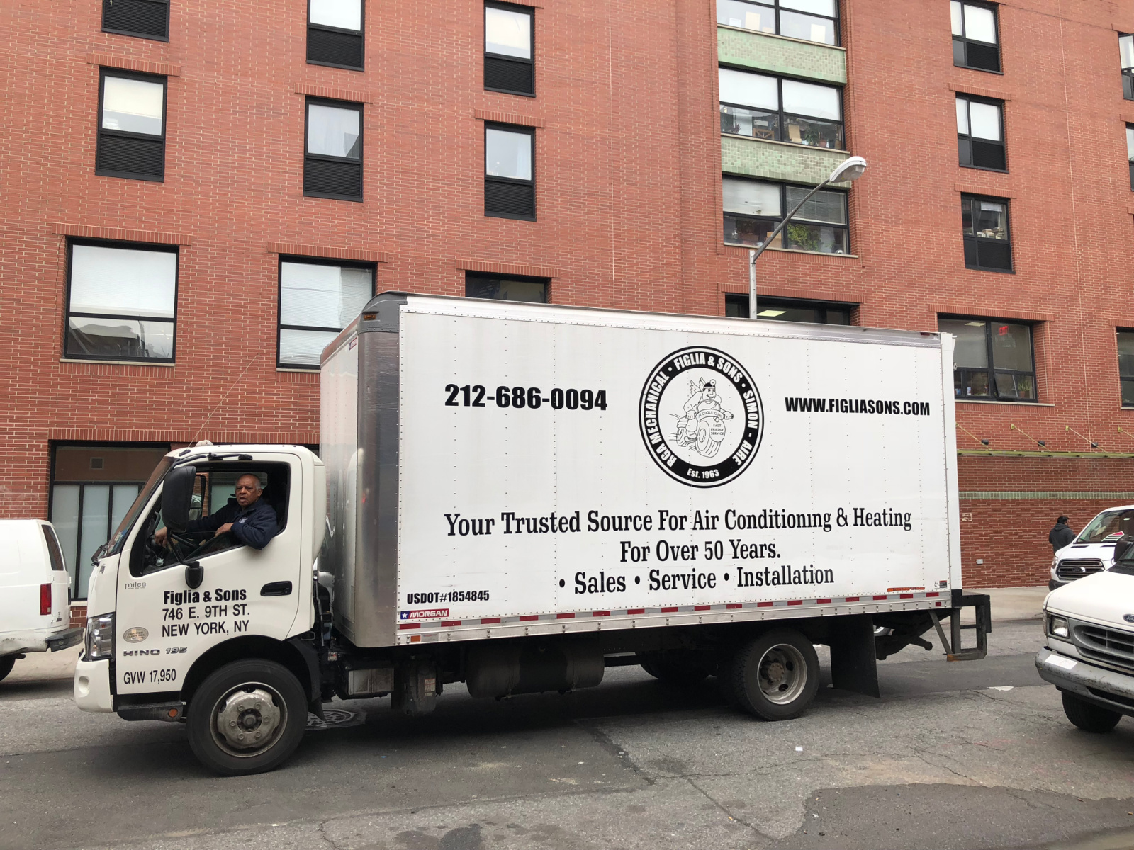Figlia and Sons delivery truck in front of NYC apartment building